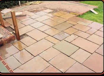 New sandstone patio being laid